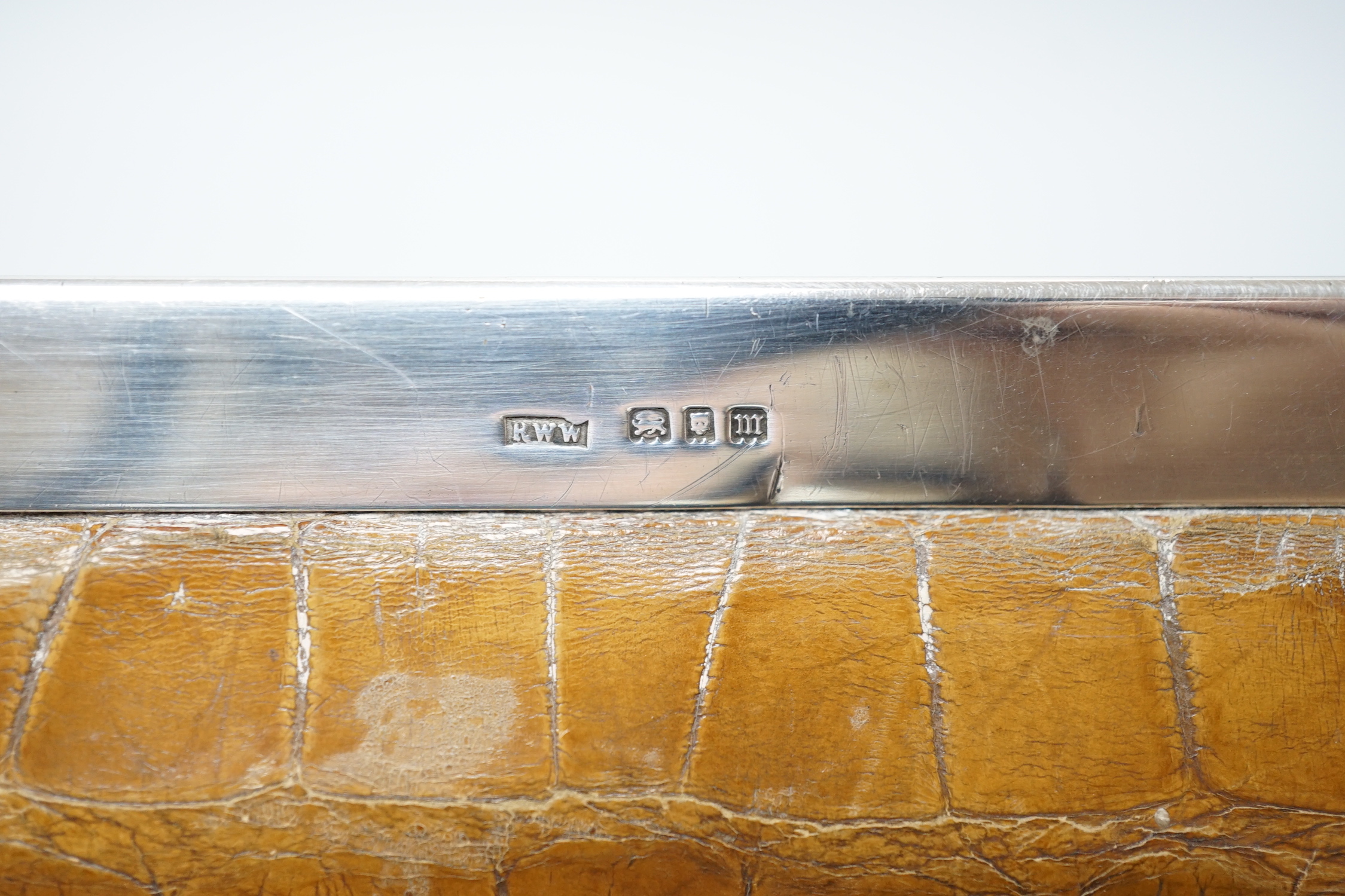 An Edwardian lady’s silver mounted crocodile clutch bag